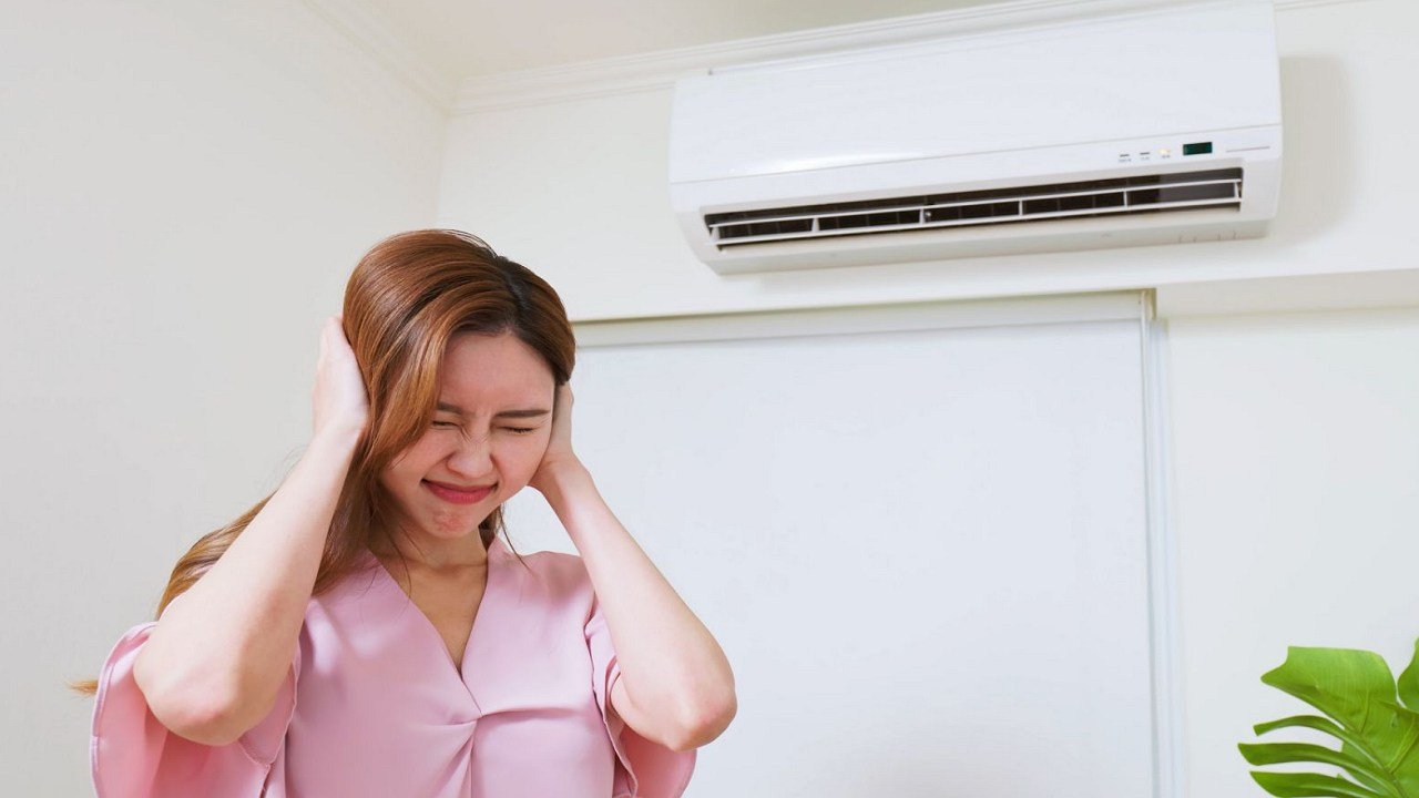 How do I fix a noisy air conditioner?