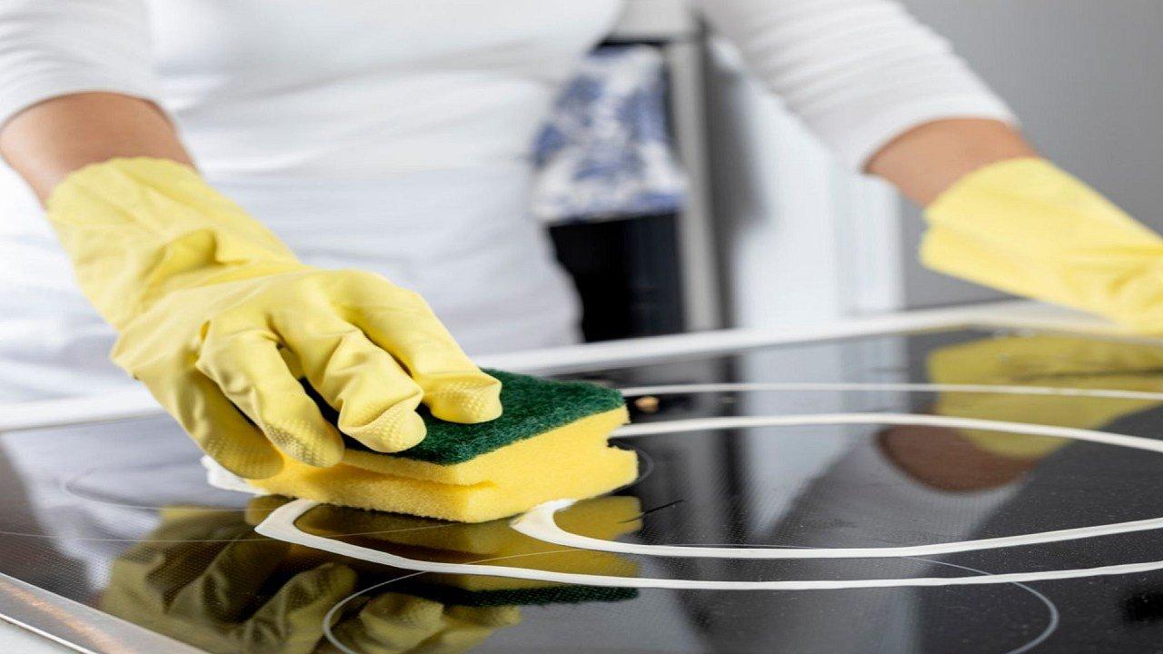 What is the best way to clean the glass cooktop on my stove?