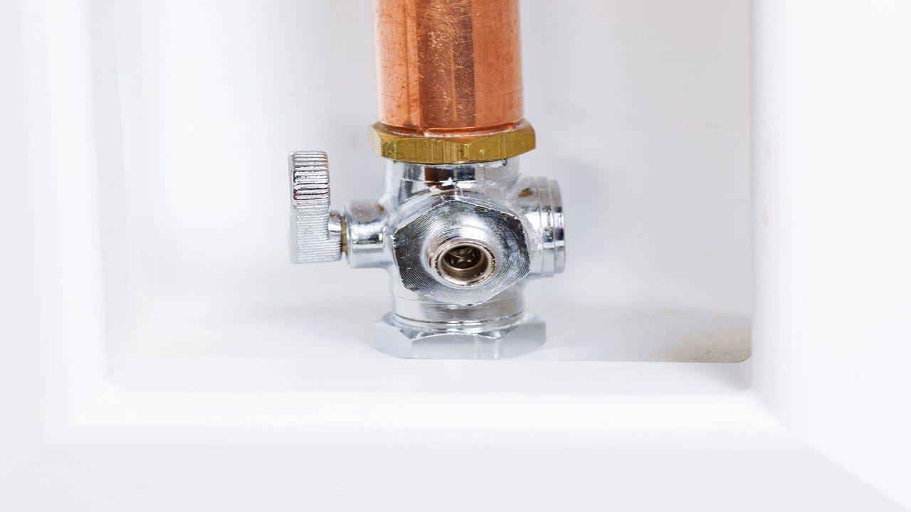 How do I replace the water inlet valve in my refrigerator?