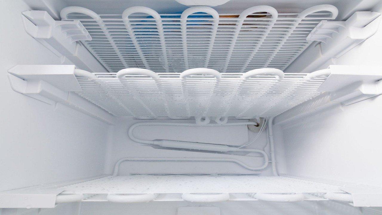 What should I do if my refrigerator is not defrosting properly?