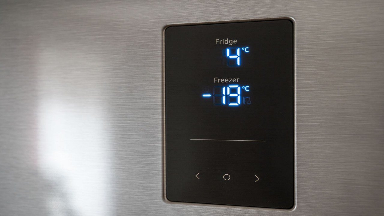 How do I adjust the temperature settings on my refrigerator?