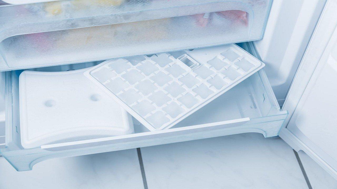 How do I clean the ice maker in my refrigerator?
