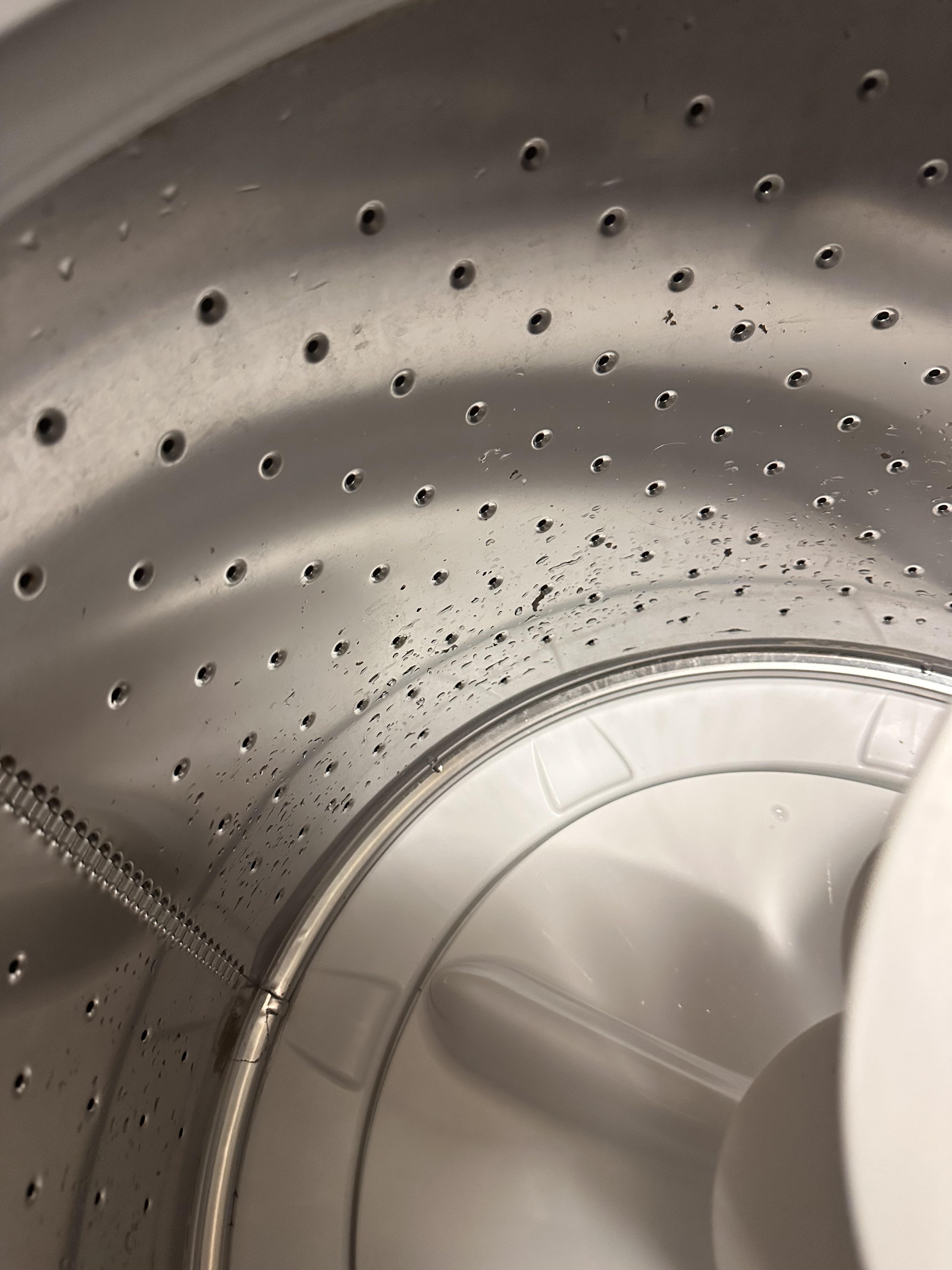 How to clean behind this GE washer model gtw330ask1ww I cleaned the